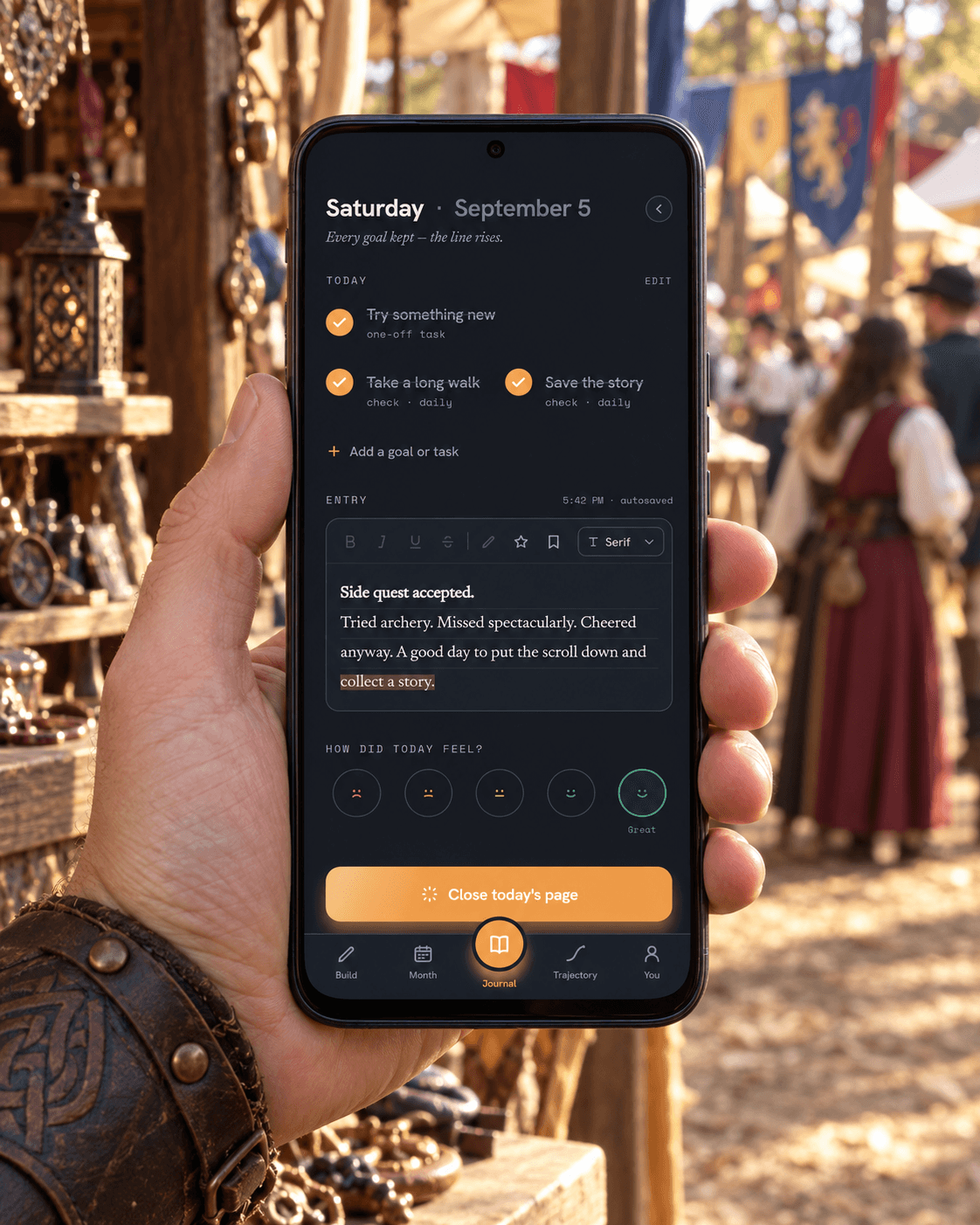 Trajectory marketing photo of a phone displaying a sample journal at a Renaissance fair